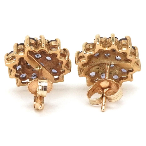 2210 - A pair of 9ct gold iolite three tier flower head stud earrings, 11.5mm in diameter, total 2.6g.