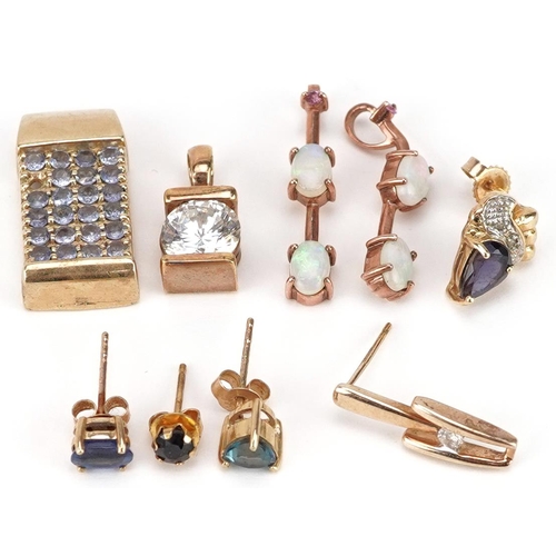 2533 - A collection of mostly 9ct gold earrings and pendants set with semi precious stones including sapphi... 