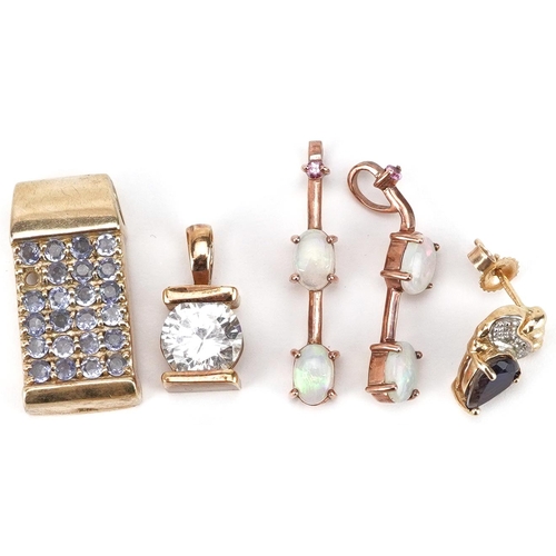 2533 - A collection of mostly 9ct gold earrings and pendants set with semi precious stones including sapphi... 