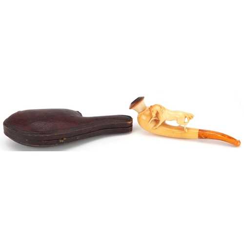 288 - An antique Meerschaum pipe with amber coloured mouthpiece in the form of a horse, housed in a silk l... 