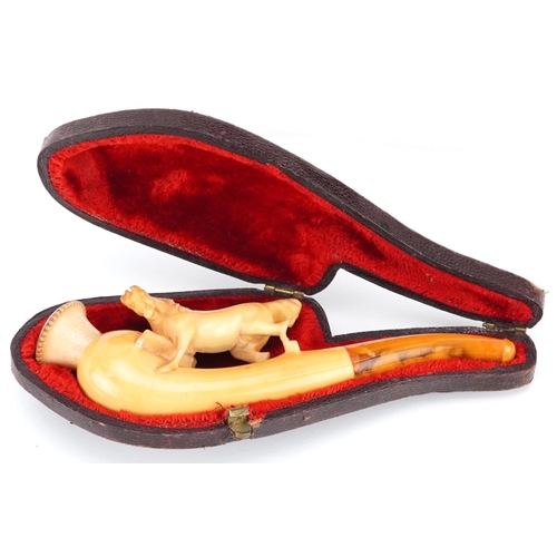 288 - An antique Meerschaum pipe with amber coloured mouthpiece in the form of a horse, housed in a silk l... 