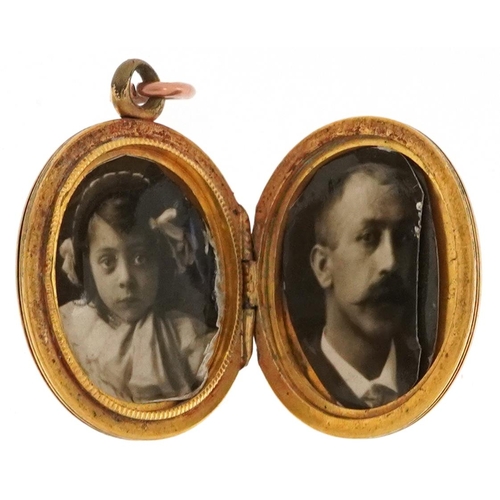 2342 - A Victorian yellow metal locket engraved with foliage, 2.6cm high, 5.2g.