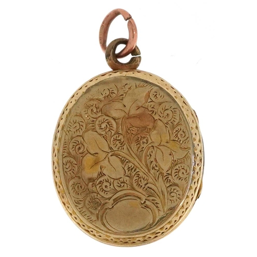 2342 - A Victorian yellow metal locket engraved with foliage, 2.6cm high, 5.2g.