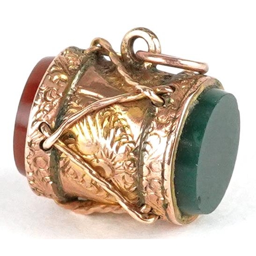 2332 - An antique unmarked rose gold carnelian and bloodstone charm in the form of a military drum, 11.6mm ... 