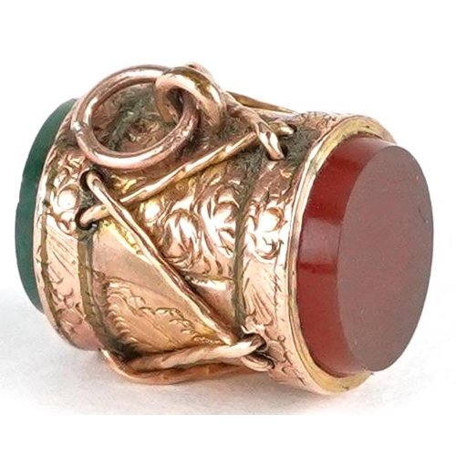 2332 - An antique unmarked rose gold carnelian and bloodstone charm in the form of a military drum, 11.6mm ... 