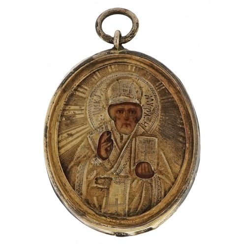 2535 - A Russian silver mounted travelling icon pendant depicting St. Nicholas the Wonderworker, detailed C... 