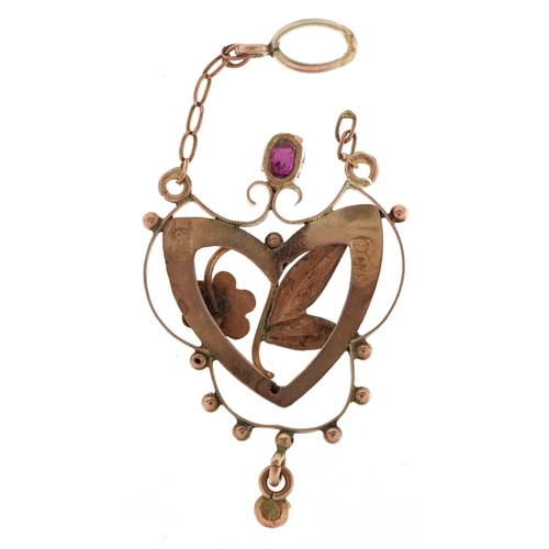 2381 - An Art Nouveau 9ct gold garnet and seed pearl openwork pendant, 2.5cm high, 1.1g.