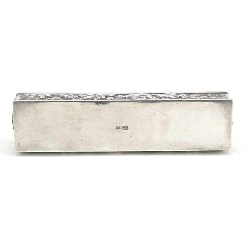 58 - A Chinese export rectangular silver box with hinged lid, embossed with birds amongst flowers, SM mak... 