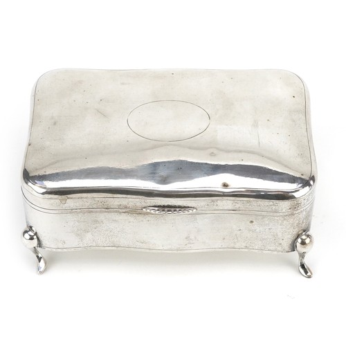 57 - Luen Wo, a Chinese export silver serpentine jewellery box raised on four feet, 7.5cm H x 16cm W x 10... 