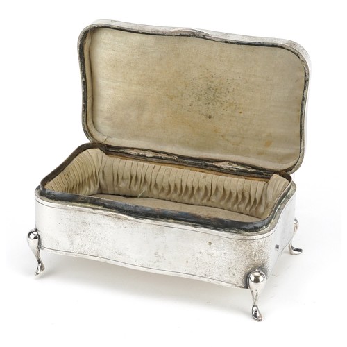 57 - Luen Wo, a Chinese export silver serpentine jewellery box raised on four feet, 7.5cm H x 16cm W x 10... 