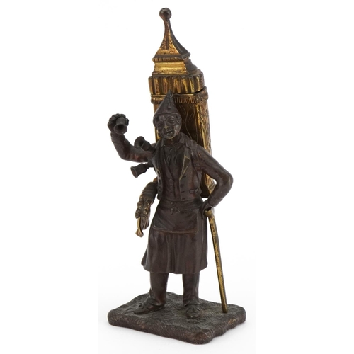 291 - 19th century partially gilt patinated bronze table vesta in the form of a pedlar, 19cm high