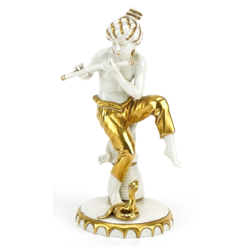 405 - Sitzendorf, German partially gilt porcelain figure of a snake charmer, 21.5cm high