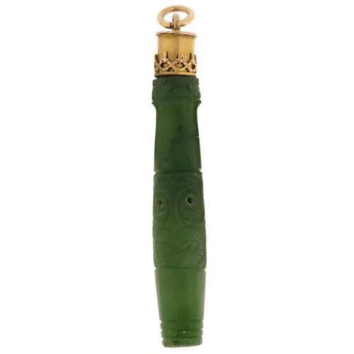 2529 - Three carved green stone jade style pendants including one with a Maori face all with yellow metal m... 