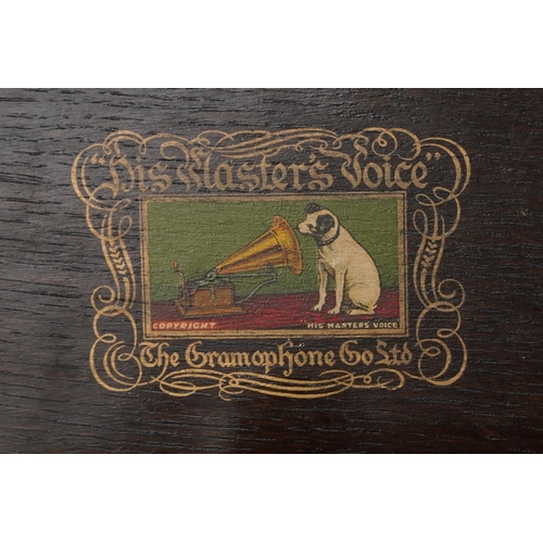 1060 - An early 20th century HMV table top gramophone within an oak case, 38cm wide.