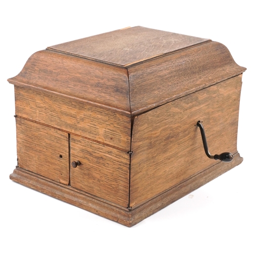 1060 - An early 20th century HMV table top gramophone within an oak case, 38cm wide.