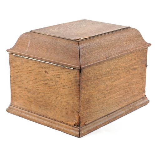 1060 - An early 20th century HMV table top gramophone within an oak case, 38cm wide.