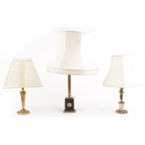 1243 - A group of three late 20th century gilt metal table lamps, 78cm high.