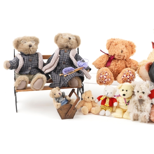 1355 - A small collection of mixed stuffed teddy bears including Rupert Bear and an example of two on a ben... 