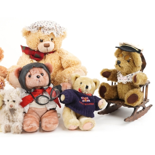 1355 - A small collection of mixed stuffed teddy bears including Rupert Bear and an example of two on a ben... 