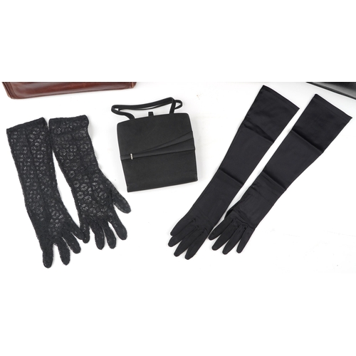 1023 - A group of four vintage and later leather ladies handbags and tow pairs of gloves.