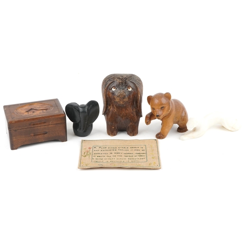 1223 - A small group of mixed collector's items including a Black Forest bear, a needlework panel, a Swiss ... 