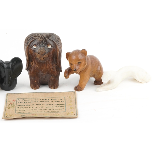 1223 - A small group of mixed collector's items including a Black Forest bear, a needlework panel, a Swiss ... 