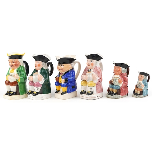 457 - A group of six 20th century Toby jugs with hand painted decoration, variously sized.