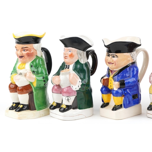 457 - A group of six 20th century Toby jugs with hand painted decoration, variously sized.