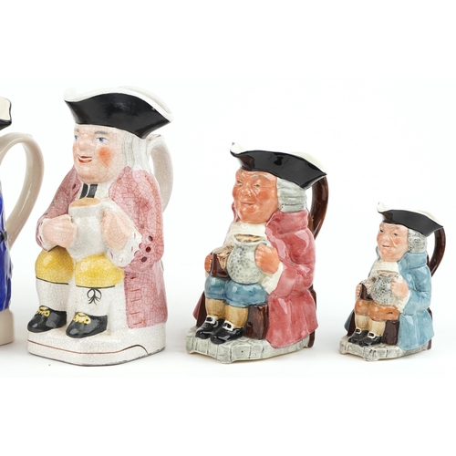 457 - A group of six 20th century Toby jugs with hand painted decoration, variously sized.