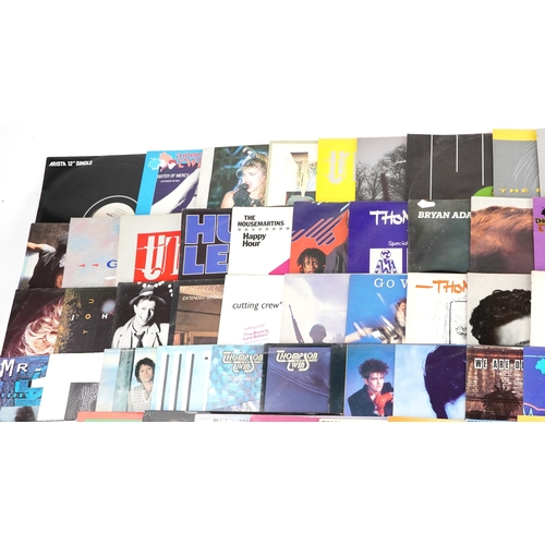 1054 - A collection of vinyl LP records including The Thompson Twins, Madonna, Huey Lewis and the News, Pau... 