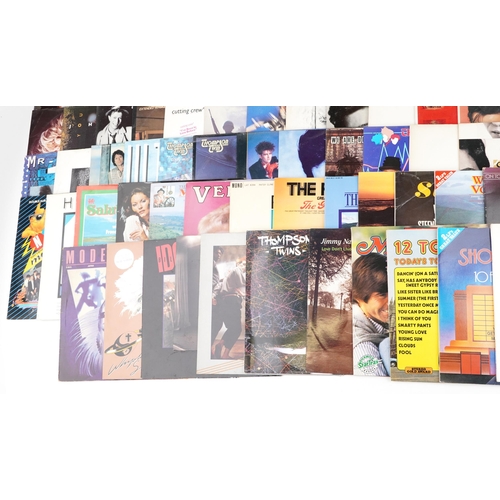 1054 - A collection of vinyl LP records including The Thompson Twins, Madonna, Huey Lewis and the News, Pau... 