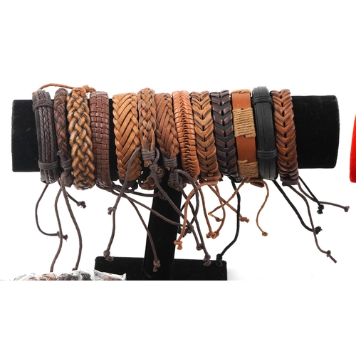 3809 - A large collection of leather bracelets, some with metal tags, including Best Friend and Dream, most... 