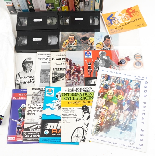 2263 - A collection of cycling ephemera including video cassettes, books, clothing, badges and brochures.