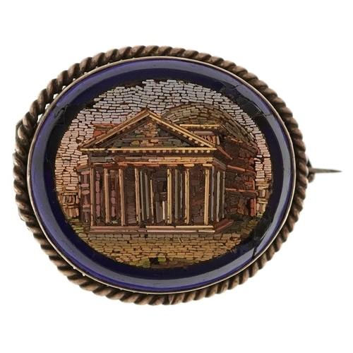 An Italian Grand Tour micro mosaic black onyx brooch with unmarked silver mount depicting the Roman Pantheon, 3.6cm wide, 10.2g