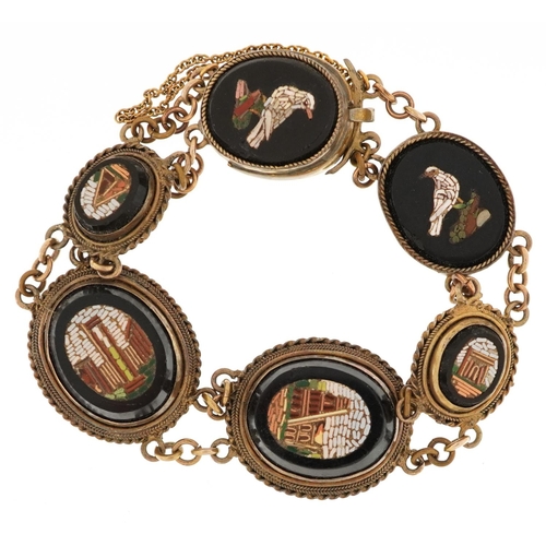 An Italian Grand Tour micro mosaic black onyx and gilt metal bracelet depicting Roman buildings and birds, 25.0g.