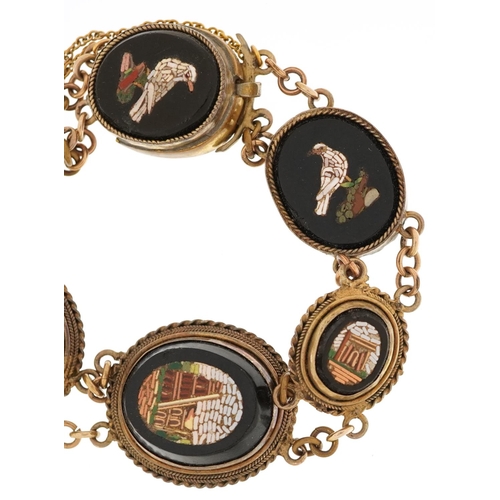  An Italian Grand Tour micro mosaic black onyx and gilt metal bracelet depicting Roman buildings and ... 