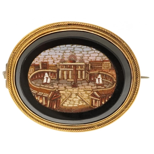 An Italian Grand Tour micro mosaic black onyx brooch depicting St. Peter's Square with gilt metal mount, 3.6cm wide, 9.6g.