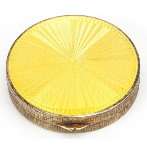 29 - Stockwell & Co., an Art Deco engine turned silver and yellow guilloche enamel compact, London import... 