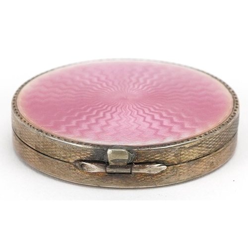 27 - Stockwell & Co., an Art Deco engine turned silver and pink guilloche enamel compact, London import m... 