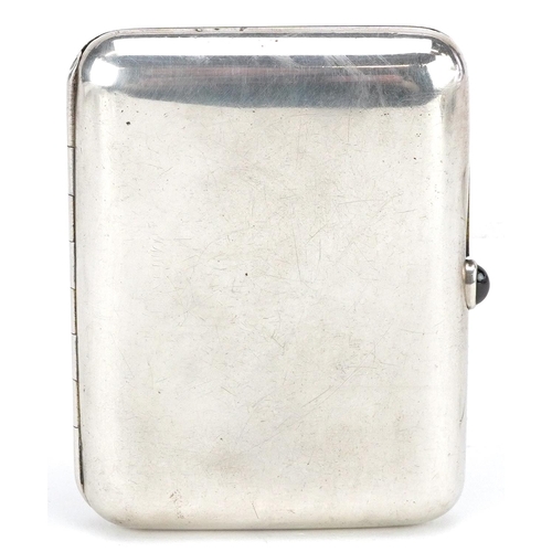 539 - A Russian silver cigarette case with cabochon garnet push button and gilt interior, with inscription... 