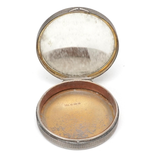  Stockwell & Co., an Art Deco engine turned silver and guilloche enamel compact hand painted with bal... 