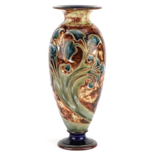 186 - An early 20th century Royal Doulton stoneware vase decorated with flowers, bearing marks to the base... 