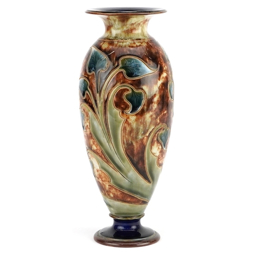 186 - An early 20th century Royal Doulton stoneware vase decorated with flowers, bearing marks to the base... 