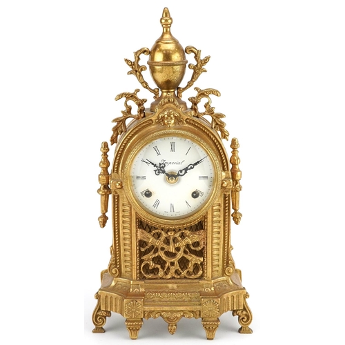 183 - A mid 20th century gilt metal cased mantle clock, the circular enamelled dial with black Roman numer... 