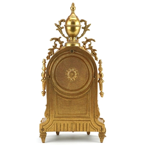 183 - A mid 20th century gilt metal cased mantle clock, the circular enamelled dial with black Roman numer... 