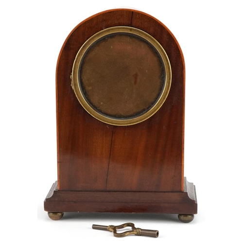 232 - An Edwardian mahogany cased mantle clock with inlaid decoration, the circular white enamelled dial o... 