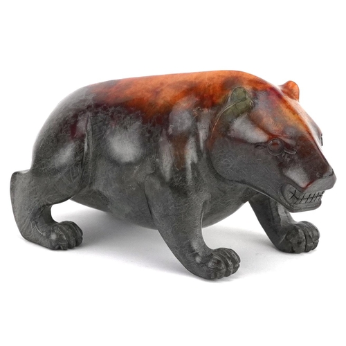 347 - A 20th century Chinese carved jade study of a bear, 13cm in length, 631.0g.