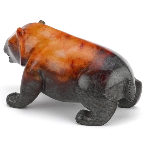 347 - A 20th century Chinese carved jade study of a bear, 13cm in length, 631.0g.