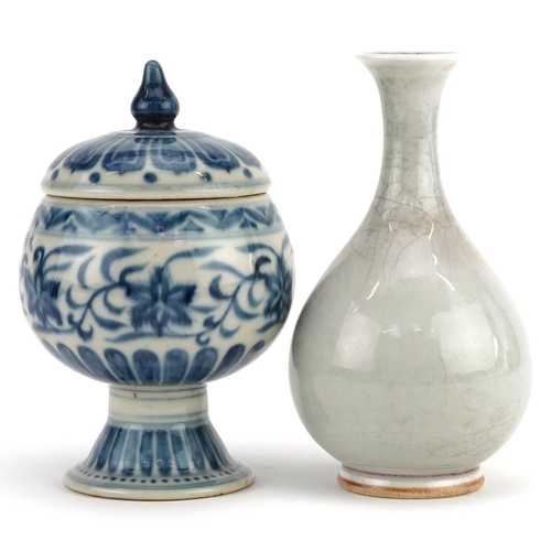 297 - A Chinese porcelain blue and white vase and cover and a cream glazed baluster vase, the largest 16cm... 