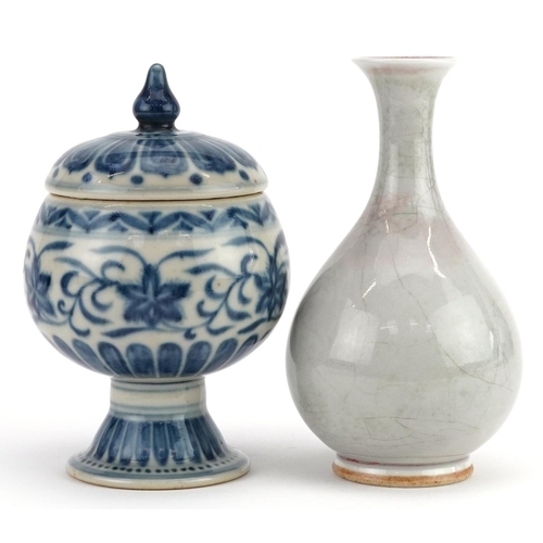 297 - A Chinese porcelain blue and white vase and cover and a cream glazed baluster vase, the largest 16cm... 